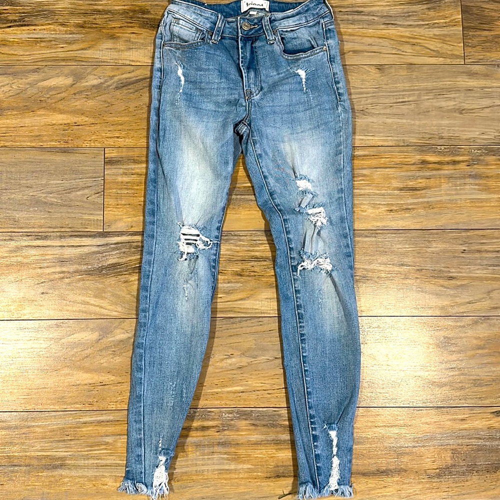 Woman’s Distressed Denim Jeans